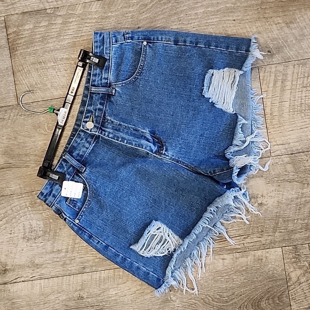 Medium dark blue distressed denim shorts